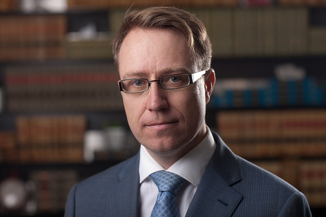 Edmonton barrister and solicitor David Archibold, a lawyer in the law firm office of Sharek Logan & van Leenen LLP, delivering legal services for litigation and corporate transactional legal cases for individuals, small businesses and large corporations.