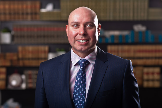 Edmonton lawyer Jonathan McCully of the law firm Sharek & Co, where he handles commercial, civic and insurance litigation, personal injury law suits and employment law.